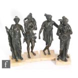 A set of four 20th century bronze Romanesque semi naked figures of maidens in classical dress,