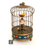 A mid 20th Century bird cage alarm clock, the brass cage with two birds that turn when wound and