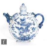 A Chinese Ming Dynasty style moonflask wine pot, of circular form, modelled with dragon spout and