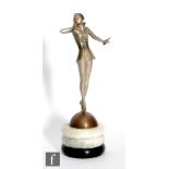 A 1930s Art Deco Josef Lorenzl patinated bronze figure of a lady stood on her tip toes with one