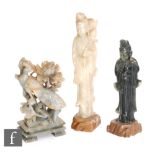 A collection of early 20th Century Chinese soapstone figures, to include two Guanyin figures dressed