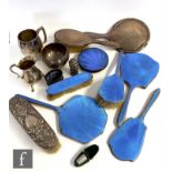 A parcel lot of assorted hallmarked silver items to include eight silver and enamelled silver backed