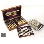 A set of six hallmarked silver and mother of pearl handled fruit knives and forks, London 1902, with