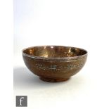 A late 19th Century Chinese silver mounted and lined coconut shell bowl with engraved character
