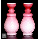 A pair of late 19th Century Stourbridge satin vase, of footed baluster form with knopped neck and