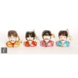 A set of four boxed Peggy Davies Pop Legend Character Jugs depicting the Beatles, modelled by Ray