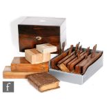 A 19th century rosewood dressing table box, the interior fitted with a tray and bottles, also a