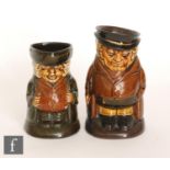 Two Royal Doulton character jugs both with dark Kingsware type glazes, the first stood with his