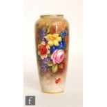 A Royal Worcester shape 2765 vase panel decorated by E. Barker with a spray of hand painted flowers,