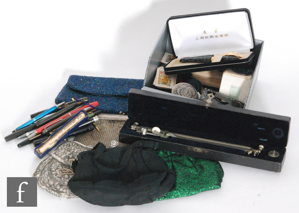 A collection of assorted fountain pens, propelling pencils, evening bags and a snuff box. (qty)