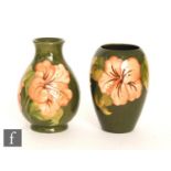 Two Moorcroft Hibiscus pattern vases, the first of baluster form, the second of tapering form,