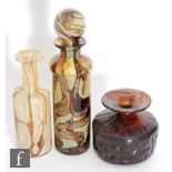 A Mdina decorative glass bottle of cylinder form with stopper, decorated with tonal brown and