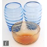 A pair of post war glass vases of ovoid form, each in a blue tint and decorated with optic moulded