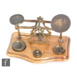 A set of Victorian brass letter scales with graduated set of brass weights, width 18cm.