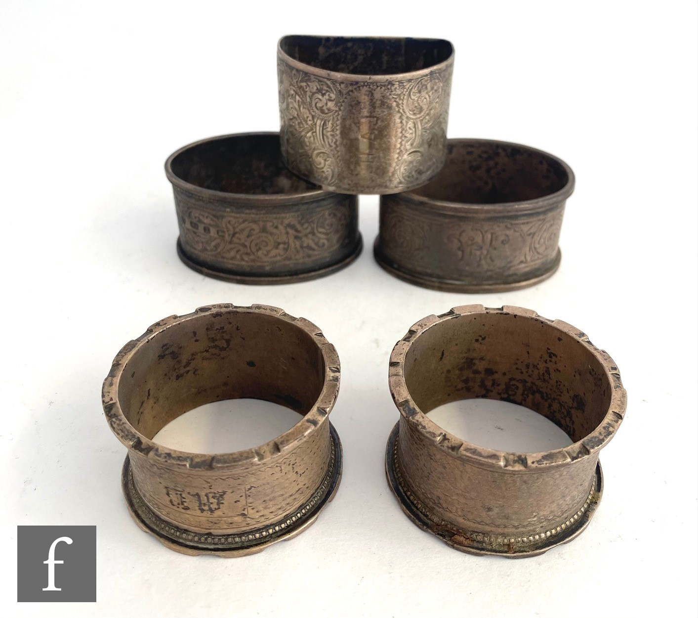 Five hallmarked silver napkin rings to include circular and oval examples, total weight 4.5oz,
