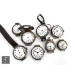 Eight early 20th Century hallmarked silver wrist watches to include a half hunter example, A/F. (8)