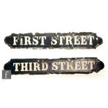 A pair of Victorian street signs, First Street and Third Street, with white lettering on a cobalt