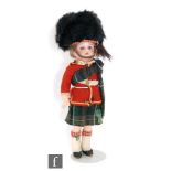 A Kammer and Reinhardt bisque socket head character doll, modelled as a Scottish boy, with