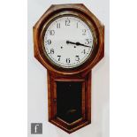 A late 19th century American mahogany octagonal cased wall clock, later white dial above a glazed
