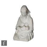 A 1930s Art Deco European blanc de chine model of the Madonna feeding her baby, incised artist