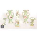 Six assorted early 20th Century vases and spill vases of varying form decorated with encrusted