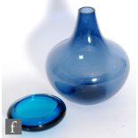 A post war glass vase of shouldered form with tapering collar neck, in a deep blue tint, height