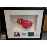 A framed Everlast boxing glove bears a signature reputedly by Muhammad Ali and Joe Frazier, with