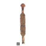 A North African wooden tribal Tuareg tent peg with chip carved decoration to one side, length