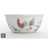 A Chinese Ming Dynasty style 'Chicken cup', the gently sloping sides decorated with Doucai glazes
