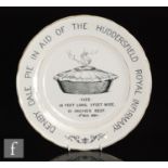 An early 20th Century commemorative plate 'Denby Dale pie in aid of the Huddersfield Royal