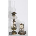 A 19th century Arts & Crafts brass oil lamp with reservoir and burner (no shade), height 70cm, and a