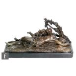 A 20th century bronze figure of a female nude holding a cherub lying on a shroud and leafy base,