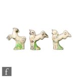 A set of three Clarice Cliff Spring Lamb figures with flowers and grasses picked out in enamels,