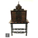 A 19th Century continental Ausberg style ebonised boulework and red tortoiseshell cabinet chest on