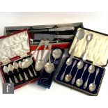 A small parcel lot of silver flat ware to include two cased sets of six hallmarked tea spoons, a set