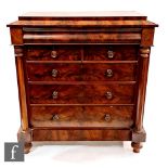 A Victorian mahogany chest of two shirt and three long drawers, turned wood handles flanked by