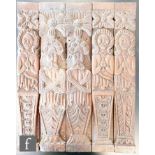 A pair of 18th Century carved oak caryatids depicting a bearded gent with crossed hands and a