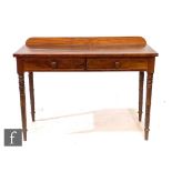 A Victorian mahogany two drawer washstand fitted with two frieze drawers below a ledge back, on ring
