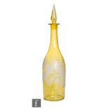A 19th Century continental bottle form decanter cased in citron over clear and flash engraved with a