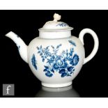 A late 18th Century globular teapot in the underglaze blue and white Three Flowers pattern, crescent