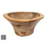 A 19th Century wooden mixing bowl carved from a solid piece, diameter 46cm.