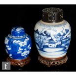 Two Chinese blue and white jars, the first of rounded form with landscape design, with later