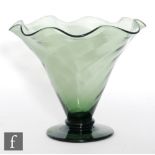 A large 20th century Stuart & Sons green glass vase of footed flared form with wide flared waved