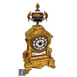 A late 19th century French mantle porcelain and gilt metal mantle clock, eight day striking