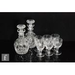 A pair of Stuart & Sons glass decanters of ovoid form with tall ribbed collar neck below a