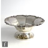 An Art Deco hallmarked silver pedestal dish of octagonal form raised to a plain circular foot,