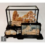 Three Chinese cork work diarama or sculptures, intricately carved and depicting pagodas and