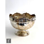 A hallmarked silver pedestal bowl of plain form terminating in scalloped boarder, height 15cm,