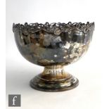 A hallmarked silver pedestal bowl of plain form with pierced floral boarder, height 19cm, weight