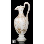 A 19th century Continental alabaster glass ewer, of footed compressed ovoid form, with collar neck